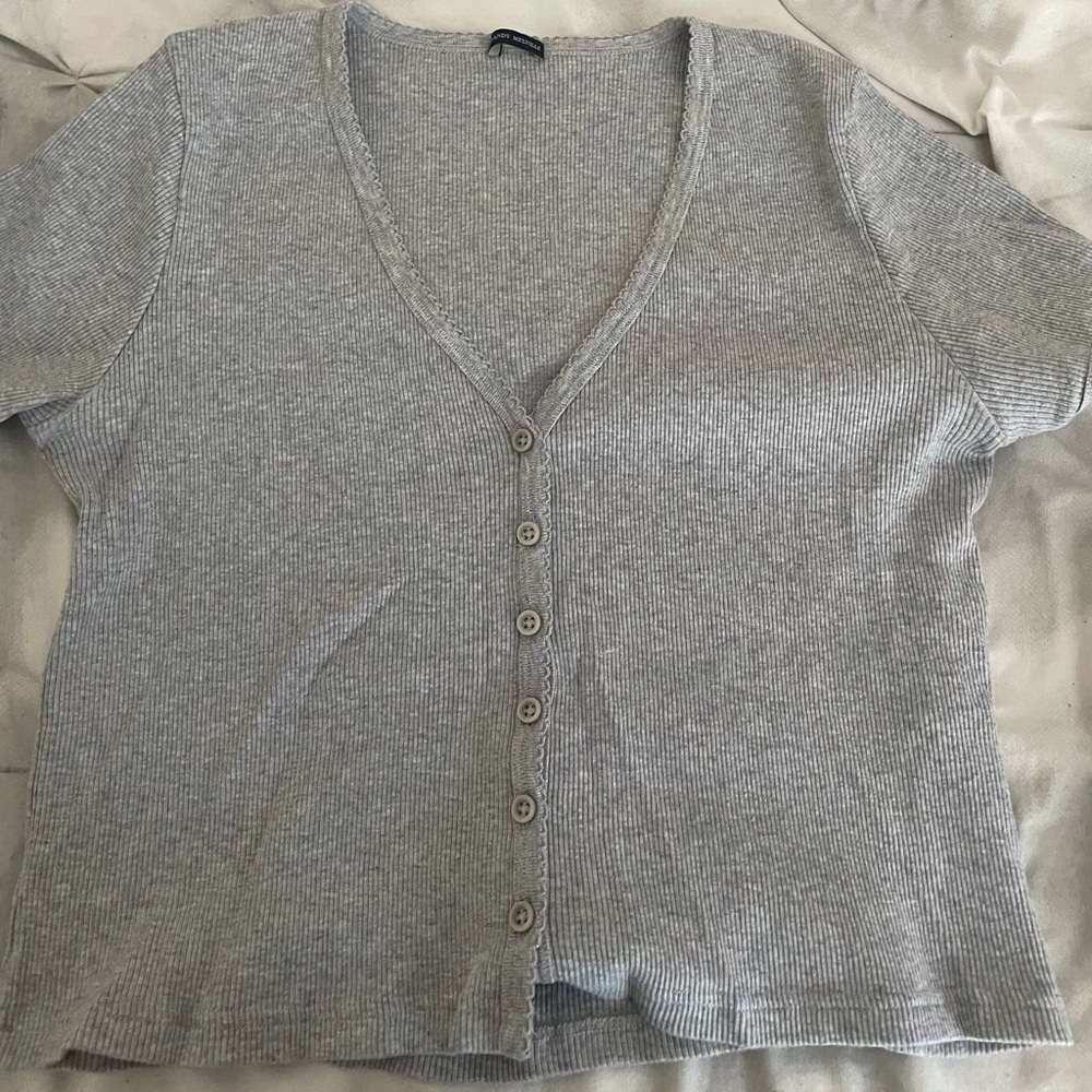 Buttoned up top